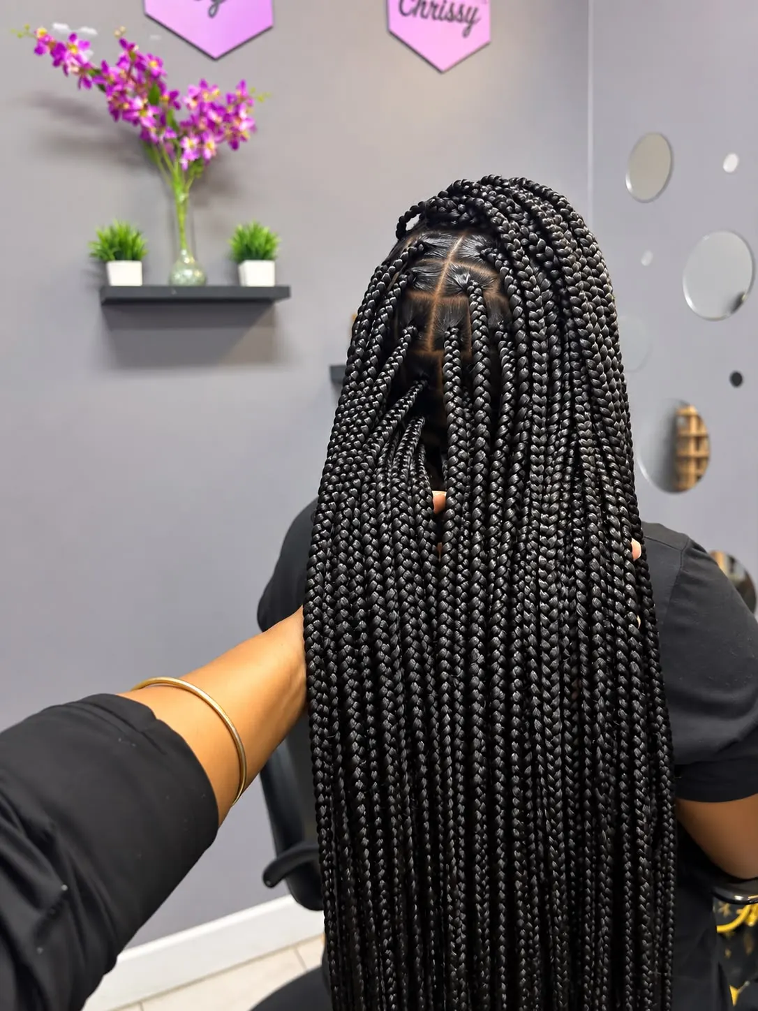 Long knotless braids photographed in the salon