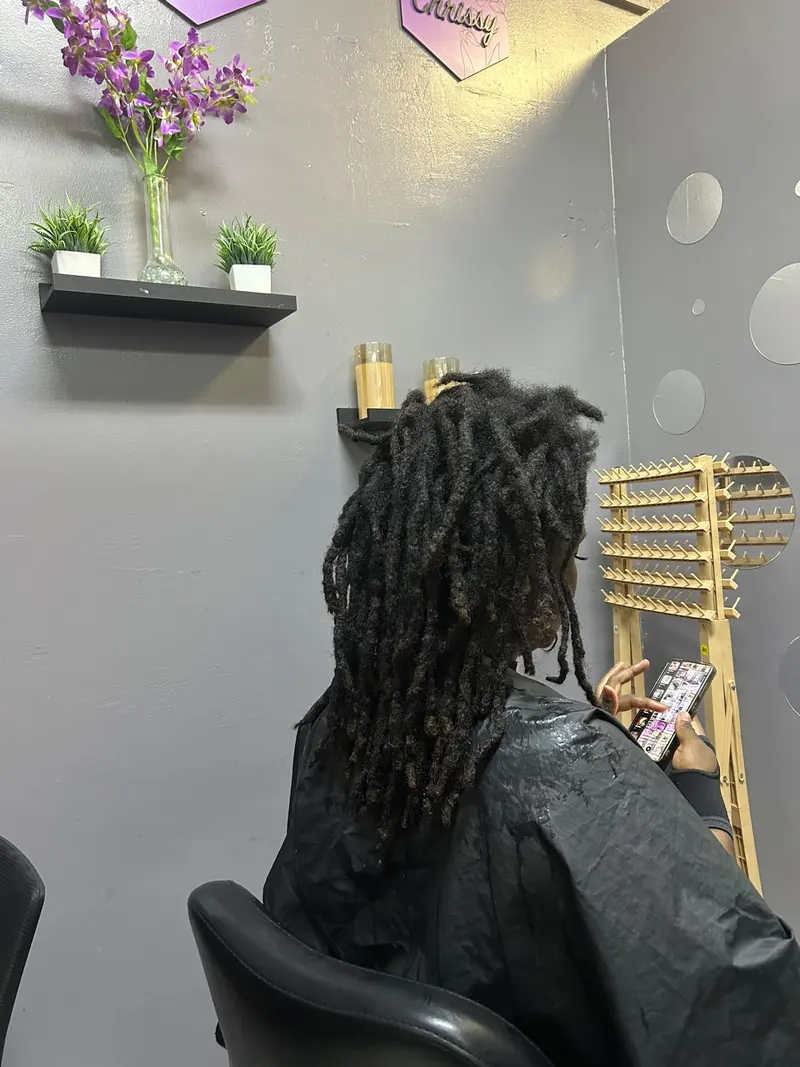 Natural locs worn down in the salon
